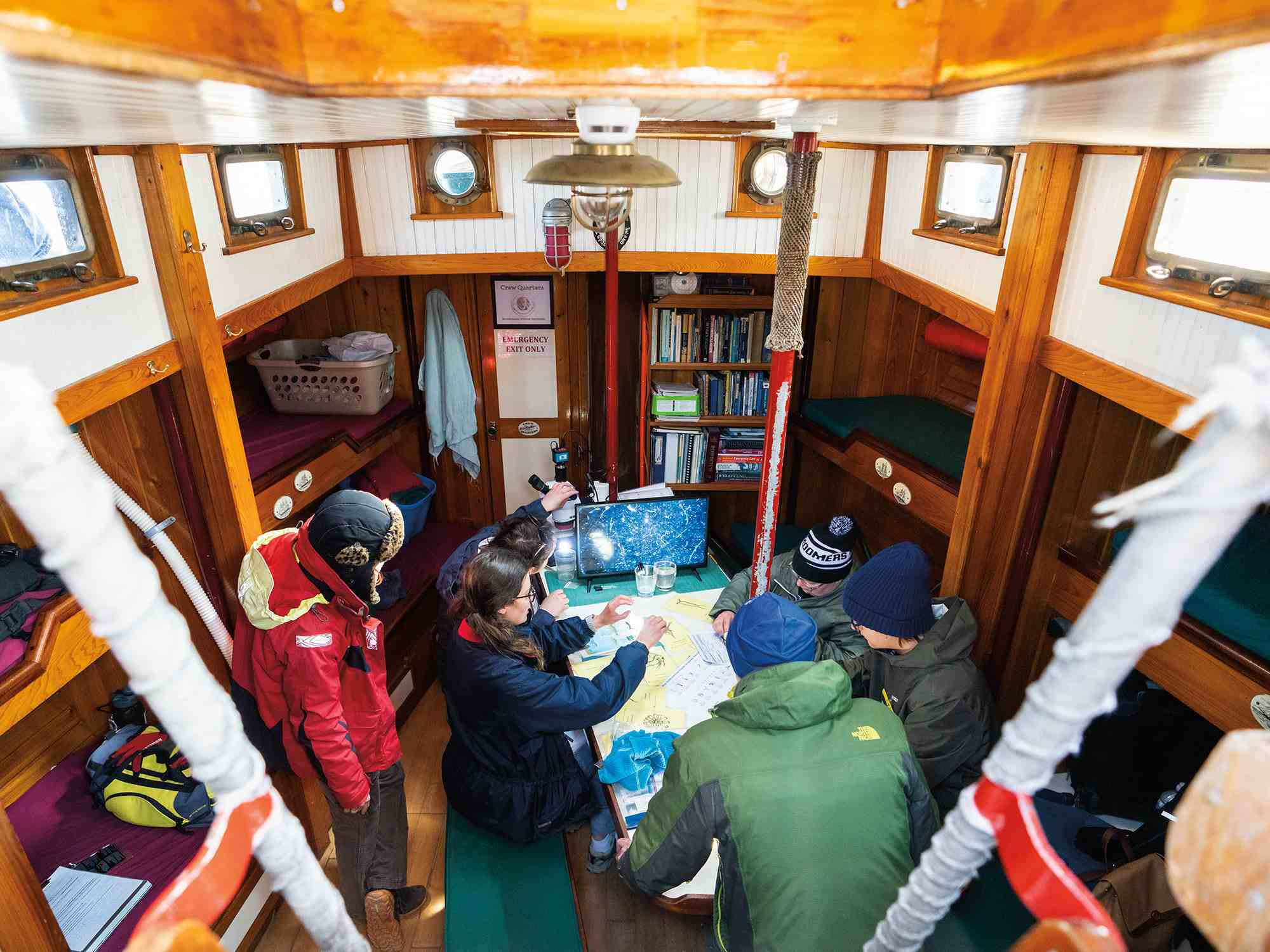 Students on a boat in the cabin